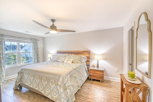 bedroom featuring light hardwood / wood-style floors and ceiling fan