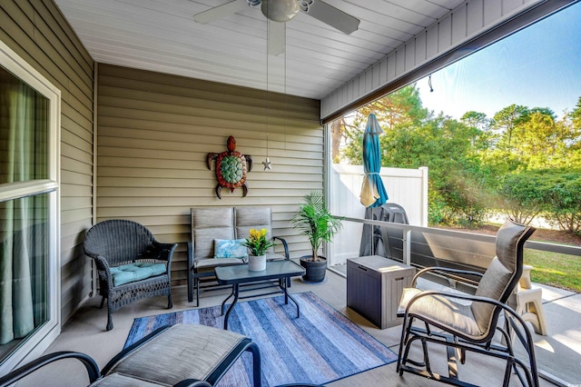 view of patio with ceiling fan and an outdoor living space