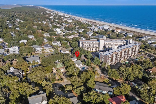 drone / aerial view featuring a water view and a beach view