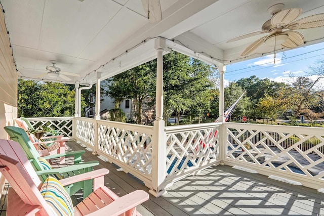 deck with a porch and ceiling fan