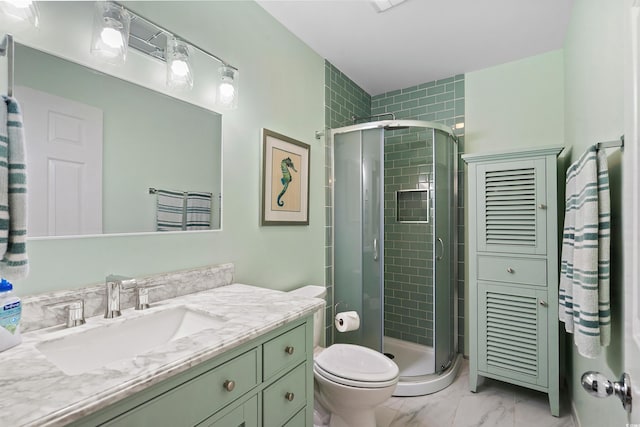 full bath featuring a stall shower, marble finish floor, vanity, and toilet