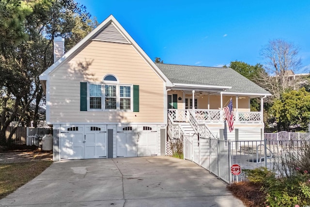 view of front facade with a garage and covered porch