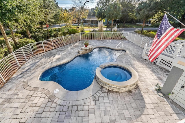 view of swimming pool featuring an in ground hot tub and a patio