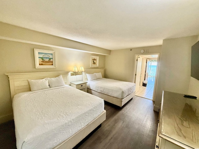 bedroom featuring dark hardwood / wood-style flooring