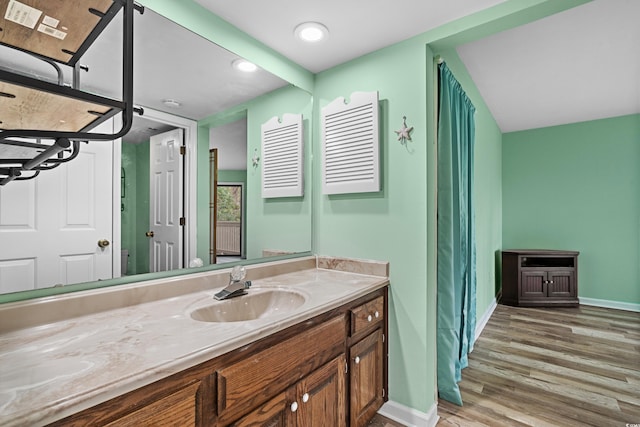 bathroom featuring hardwood / wood-style floors and vanity