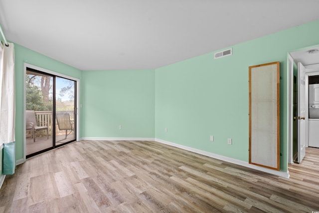 spare room featuring light hardwood / wood-style floors