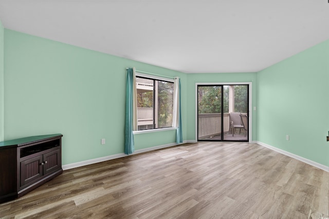 unfurnished living room with light hardwood / wood-style floors