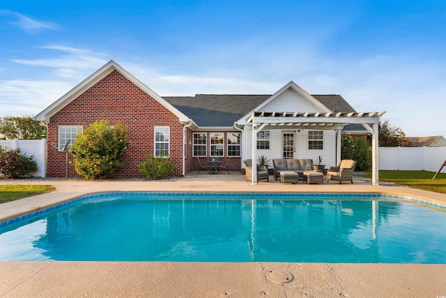 view of pool with outdoor lounge area and a patio area