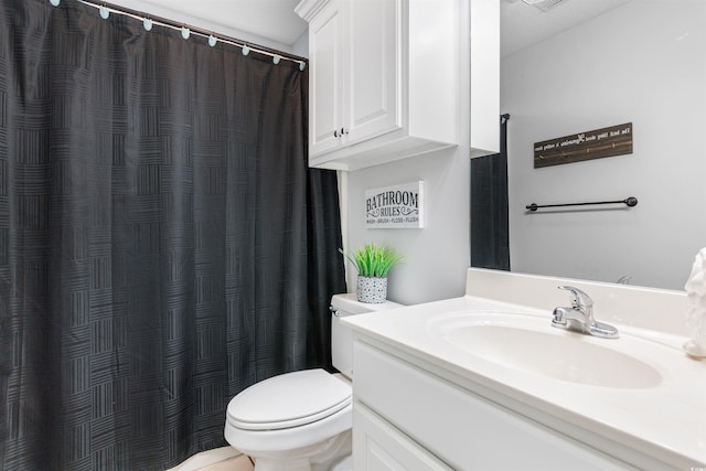 bathroom featuring toilet, visible vents, a shower with shower curtain, and vanity