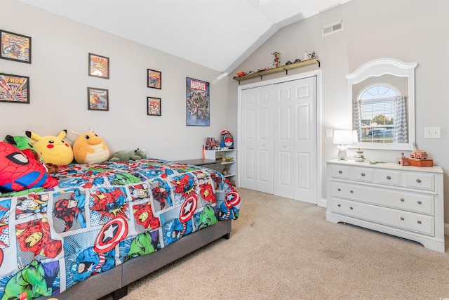 bedroom with visible vents, vaulted ceiling, a closet, and light colored carpet