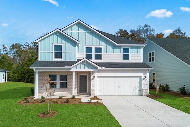 view of front of home with a garage and a front yard