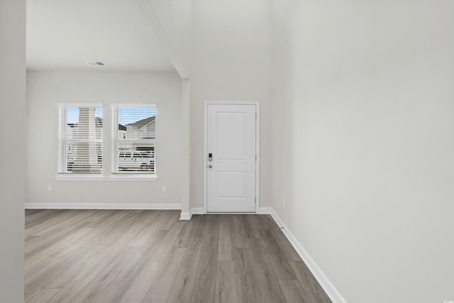 foyer entrance with light hardwood / wood-style flooring