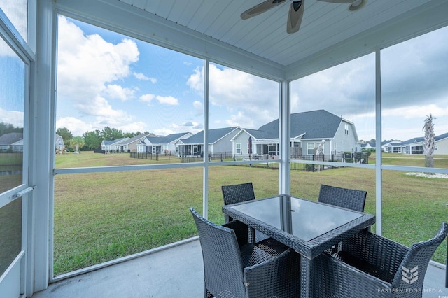 sunroom / solarium with ceiling fan