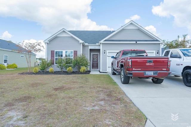 view of front of property featuring a garage and a front lawn