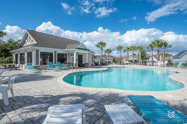 view of swimming pool featuring a patio