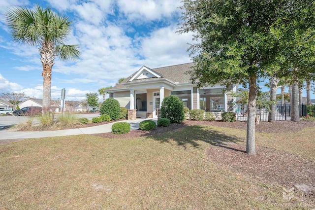 craftsman-style home with a front yard