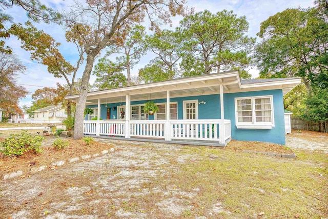 single story home with covered porch