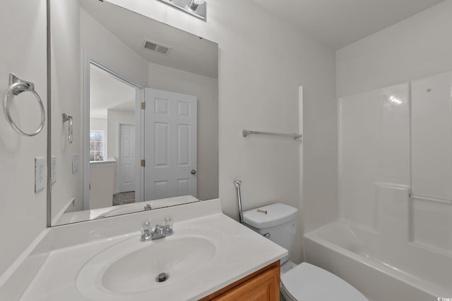 full bathroom with vanity, bathtub / shower combination, and toilet