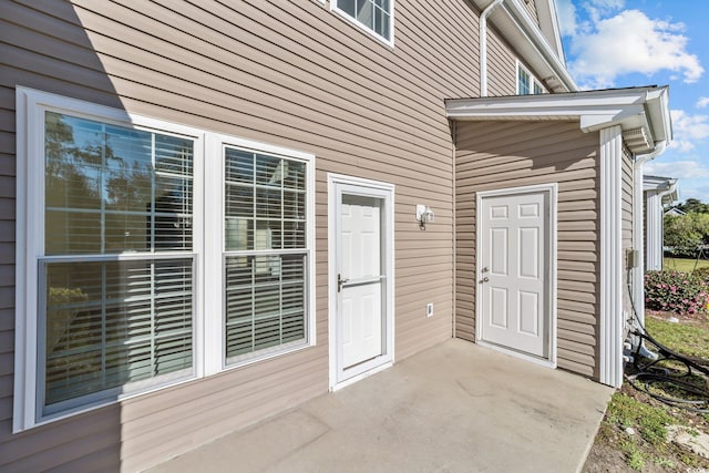 doorway to property with a patio area