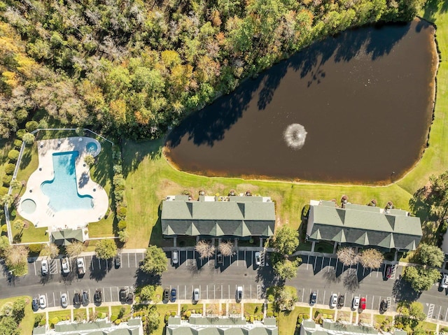 birds eye view of property with a water view