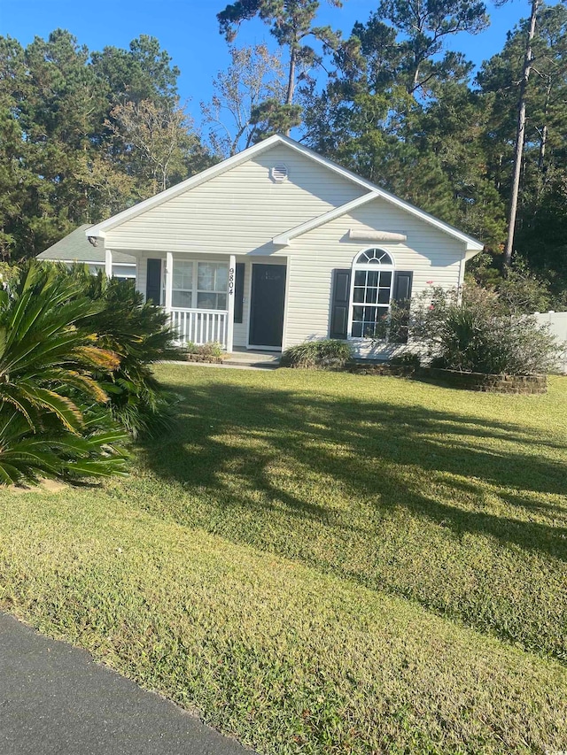 ranch-style house with a porch and a front lawn