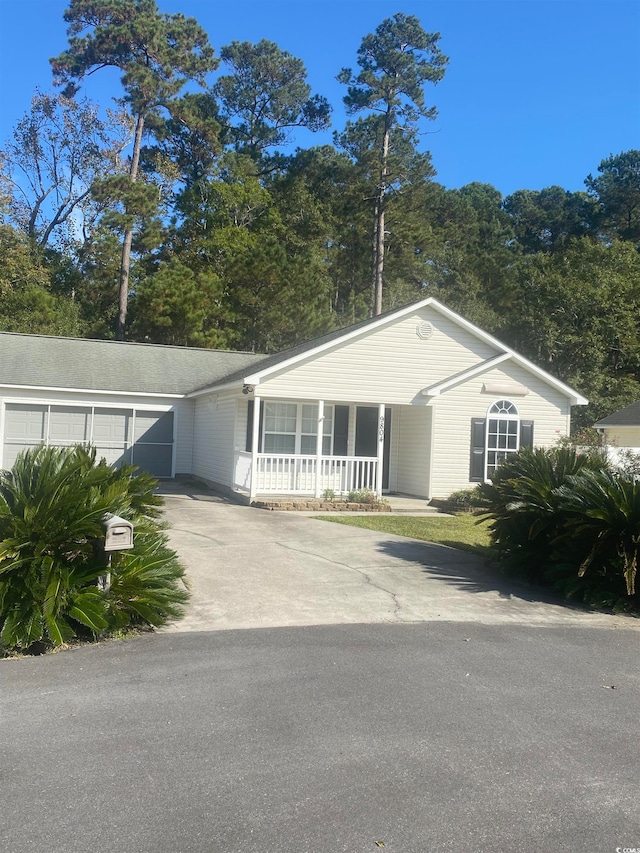 single story home featuring covered porch