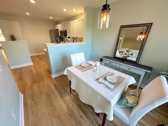 dining room featuring light hardwood / wood-style floors