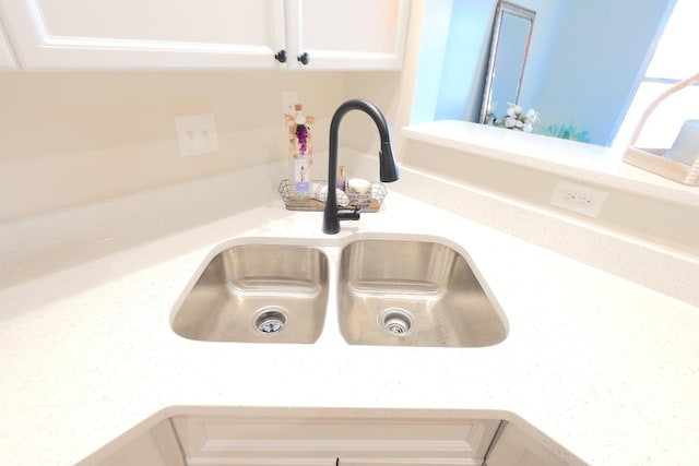 kitchen featuring white cabinetry, sink, stainless steel appliances, and light hardwood / wood-style floors