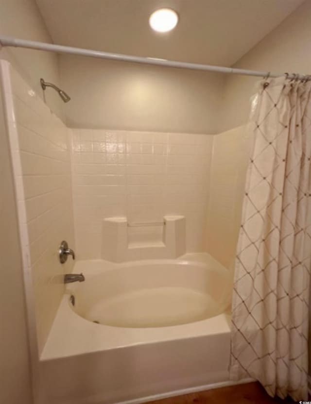 bathroom featuring shower / bath combination with curtain