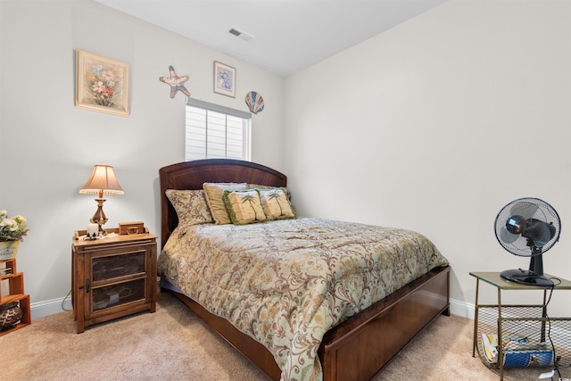 bedroom with light colored carpet