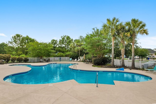 view of swimming pool featuring a patio area