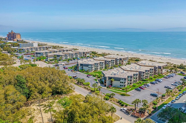 aerial view with a water view and a view of the beach