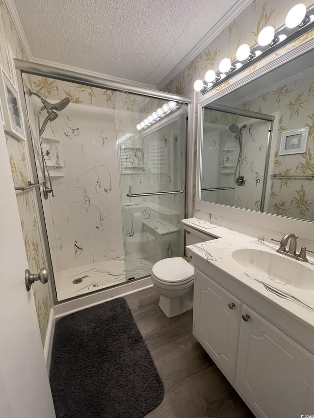 full bathroom with crown molding, wood finished floors, wallpapered walls, a textured ceiling, and a marble finish shower