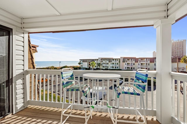 balcony featuring a water view