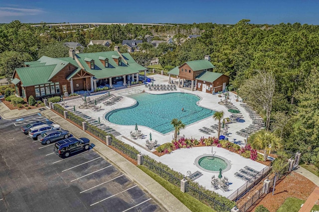 view of pool featuring a patio and a community hot tub