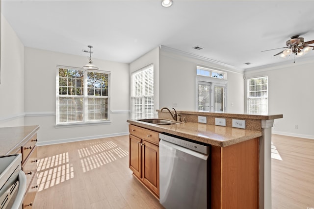 kitchen featuring sink, decorative light fixtures, light wood-type flooring, electric range, and dishwasher