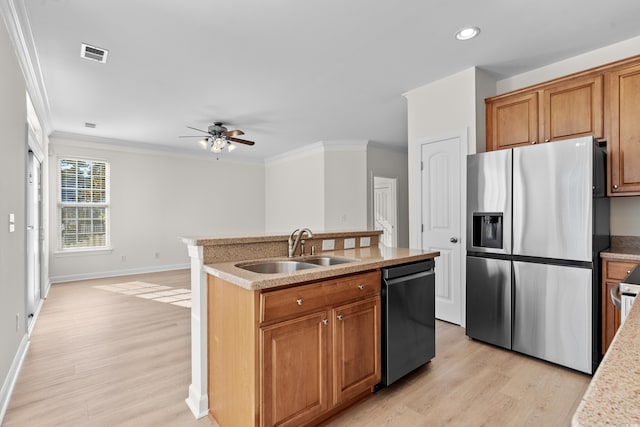 kitchen featuring sink, stainless steel fridge with ice dispenser, a center island with sink, ornamental molding, and black dishwasher