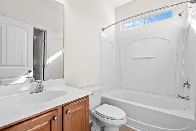 full bathroom with vanity, shower / bathtub combination, and toilet