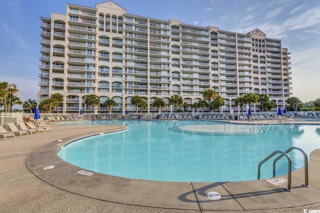 view of swimming pool featuring a patio area