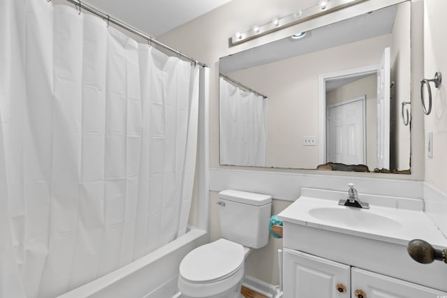 full bathroom with vanity, toilet, and shower / bath combo with shower curtain