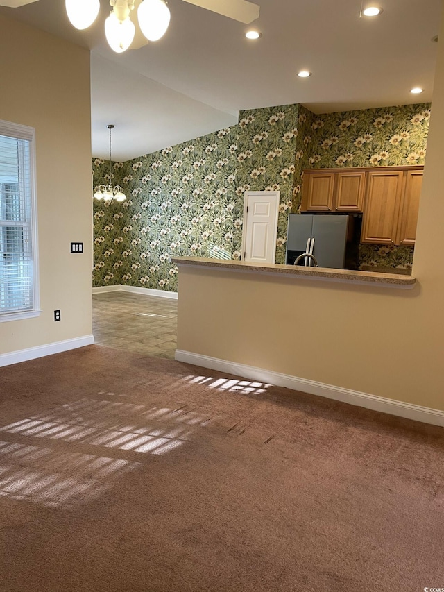 interior space featuring carpet floors and a notable chandelier