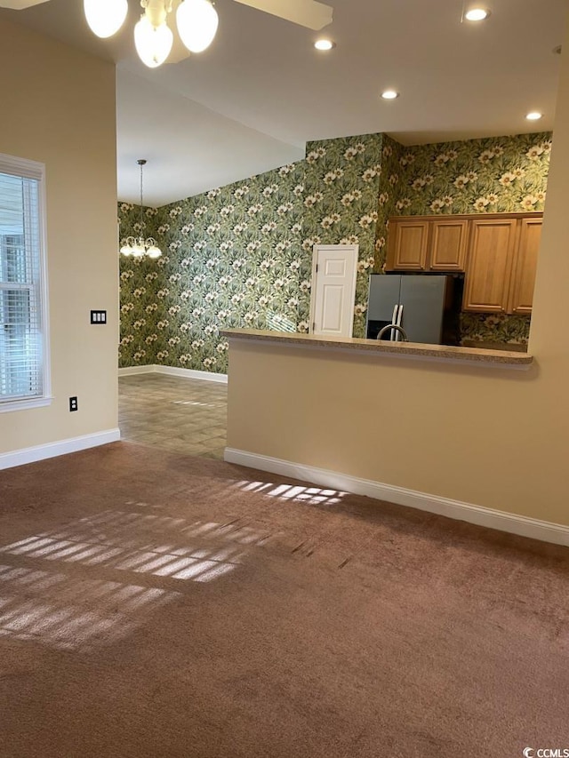 323 Sea Turtle Dr, Myrtle Beach, SC 29588 - unfurnished living room featuring wallpapered walls, a chandelier, baseboards, carpet floors, and recessed lighting
