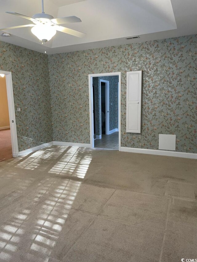323 Sea Turtle Dr, Myrtle Beach, SC 29588 - empty room featuring carpet floors, ceiling fan, baseboards, and wallpapered walls
