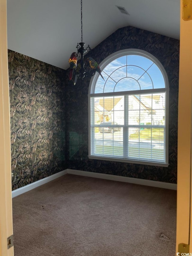 323 Sea Turtle Dr, Myrtle Beach, SC 29588 - carpeted spare room with a chandelier, wallpapered walls, vaulted ceiling, and baseboards