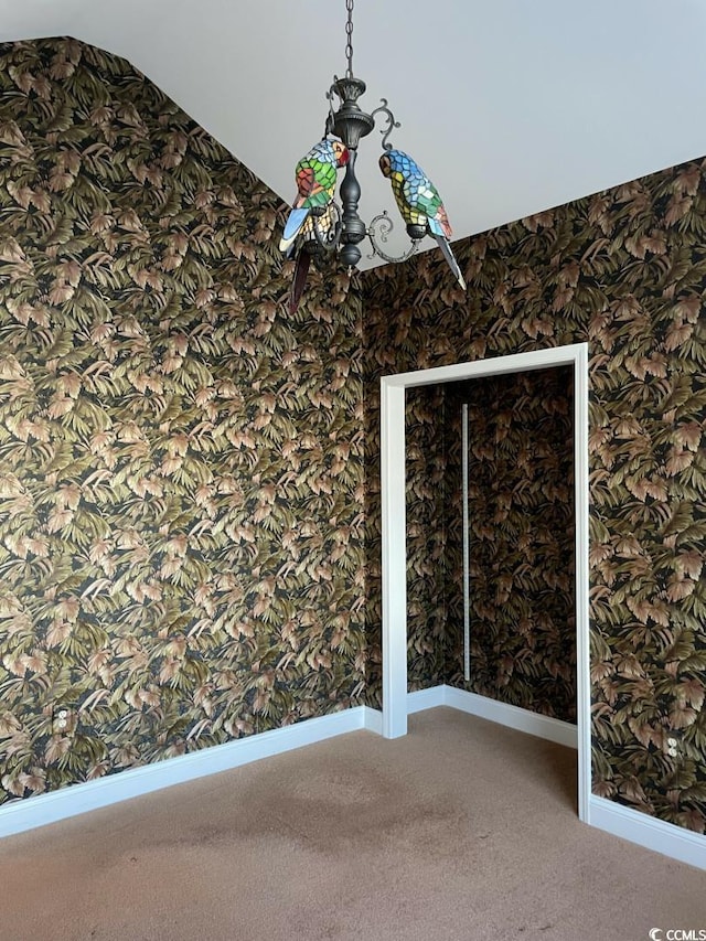 323 Sea Turtle Dr, Myrtle Beach, SC 29588 - carpeted empty room featuring wallpapered walls, baseboards, and lofted ceiling