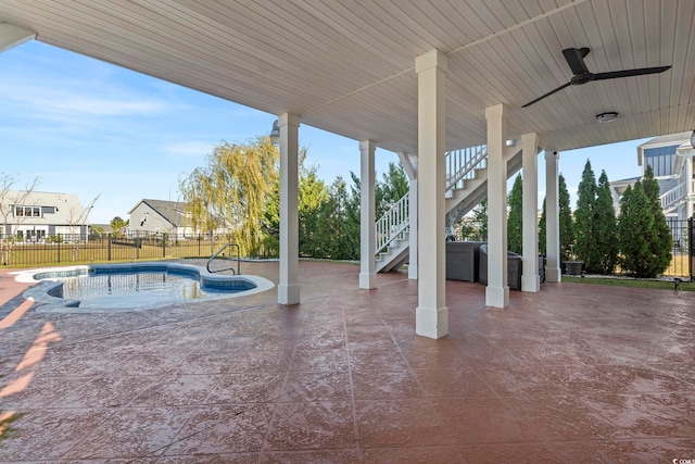 338 Harbour View Dr, Myrtle Beach, SC 29579 - fenced backyard featuring stairs, a patio area, ceiling fan, and a jacuzzi