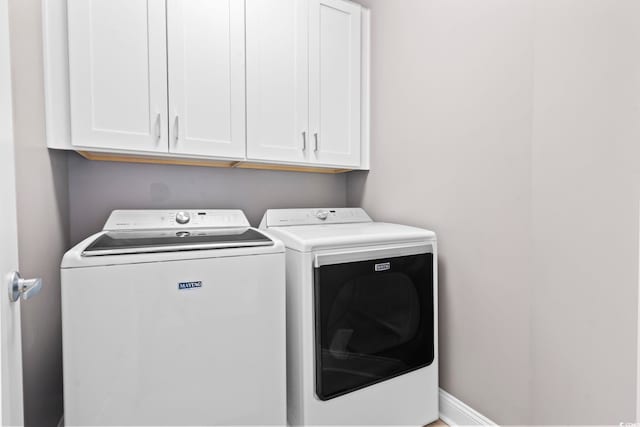 338 Harbour View Dr, Myrtle Beach, SC 29579 - laundry area featuring separate washer and dryer and cabinet space