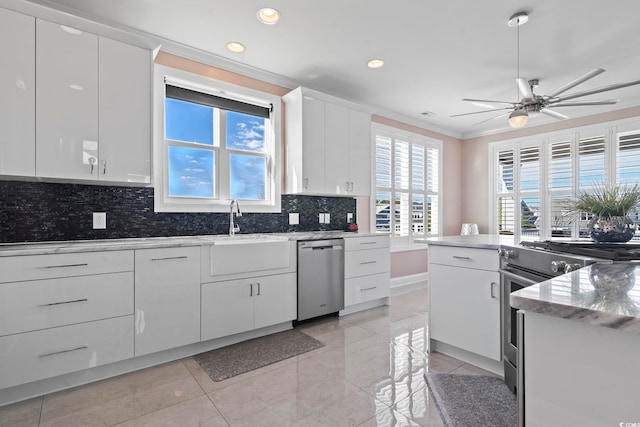 338 Harbour View Dr, Myrtle Beach, SC 29579 - kitchen featuring appliances with stainless steel finishes, crown molding, ceiling fan, decorative backsplash, and recessed lighting