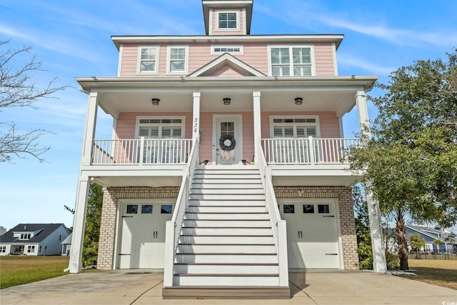 view of front of home featuring a garage and covered porch