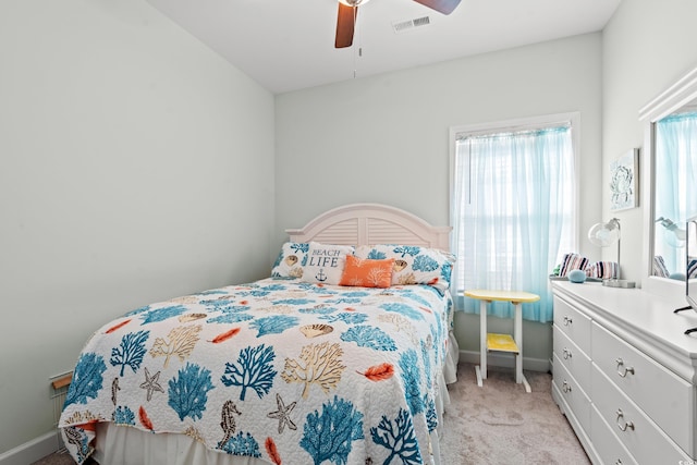 bedroom with light carpet and ceiling fan